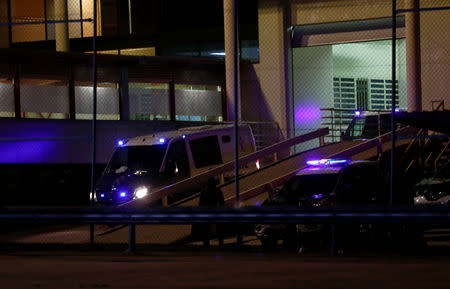 Civil Guard vans, believed to carry Catalan separatist politicians, leave prison on their to way to the Supreme Court in Soto del Real, Spain, February 12, 2019. REUTERS/Juan Medina