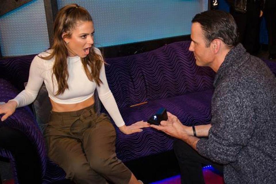 Kevin Undergaro proposing to Maria Menounos during the Howard Stern Show