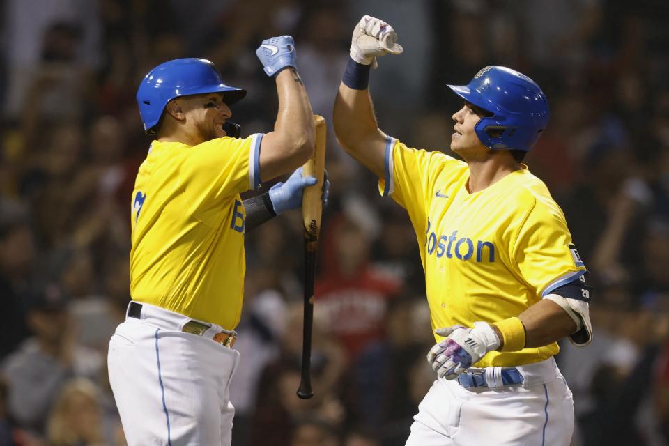 Boston Red Sox's Bobby Dalbec, right, celebrates his solo home run with Christian Vazquez during the fourth inning of the team's baseball game against the Baltimore Orioles, Friday, Sept. 17, 2021, in Boston. (AP Photo/Michael Dwyer)