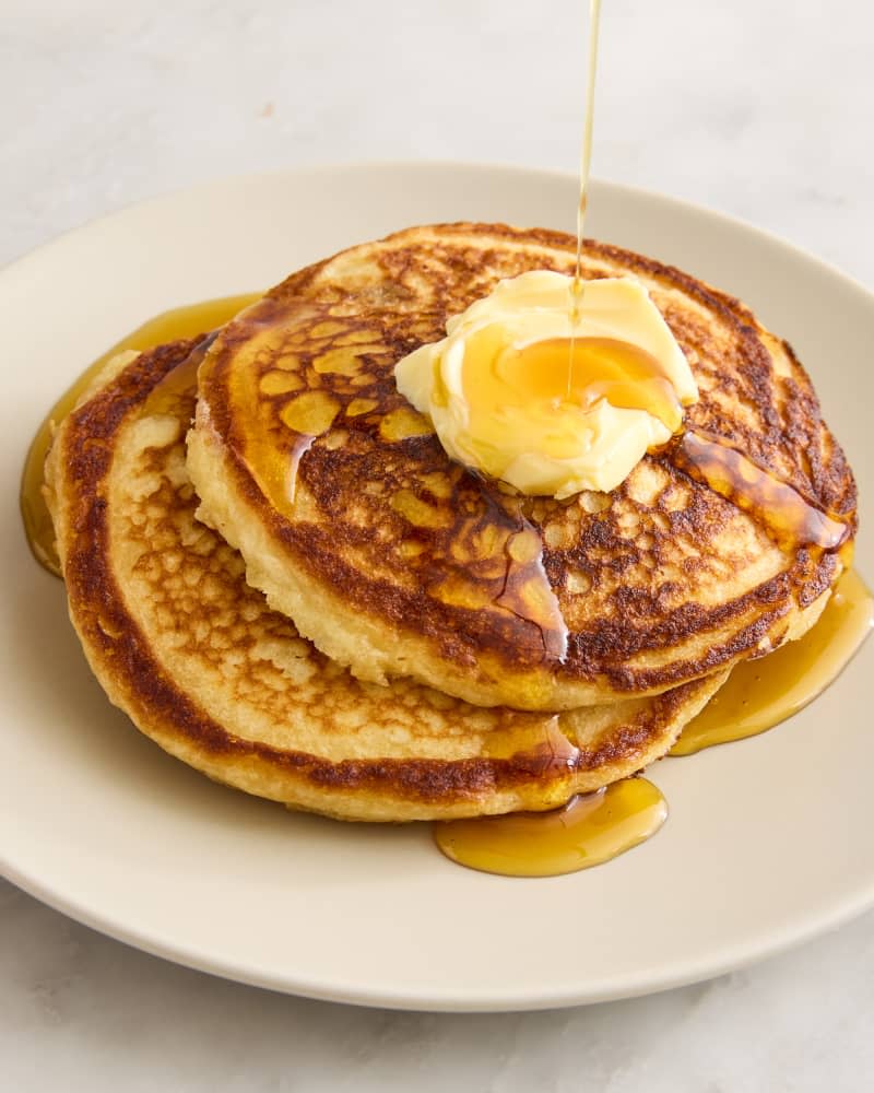 pancakes on a plate with butter and syrup