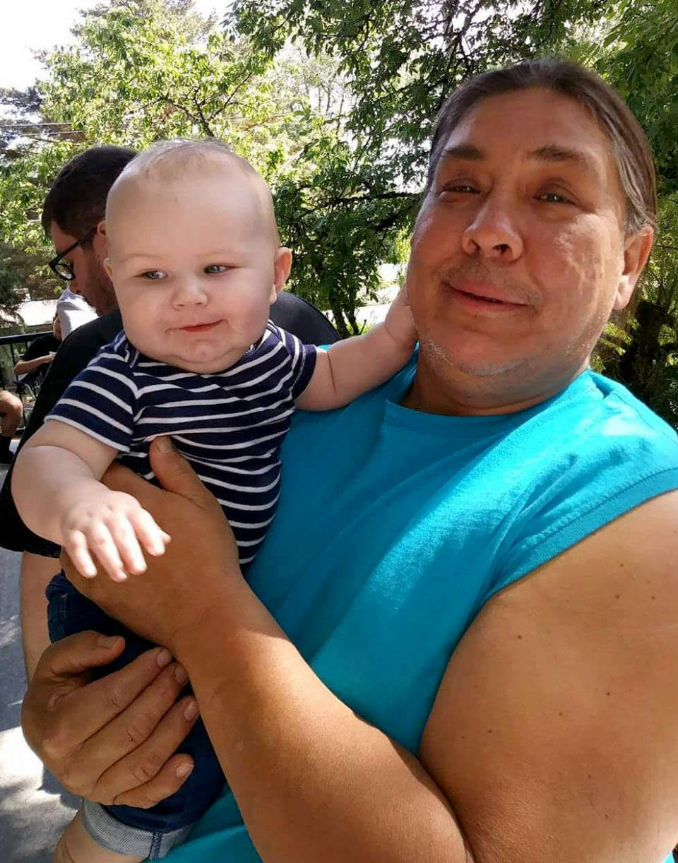 Image: Chauncey Peltier holds Leonard's great-grandson, Brayden Rand. (Courtesy of Chauncey Peltier)