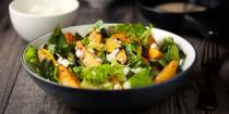 <p>This is when it's alright to judge a book by its cover. If the salad is dressed with oil and vinegar, you're in the clear. But any creamy dressings, like ranch or blue cheese, can have close to 15 grams of fat in just two tablespoons.</p>