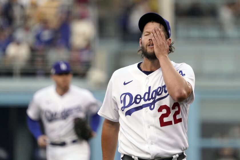 Los Angeles Dodgers starting pitcher Clayton Kershaw walks off the mound at the end of the the top of the 1st inning during Game 2 of a baseball NL Division Series, Wednesday, Oct. 12, 2022, in Los Angeles. (AP Photo/Mark J. Terrill)