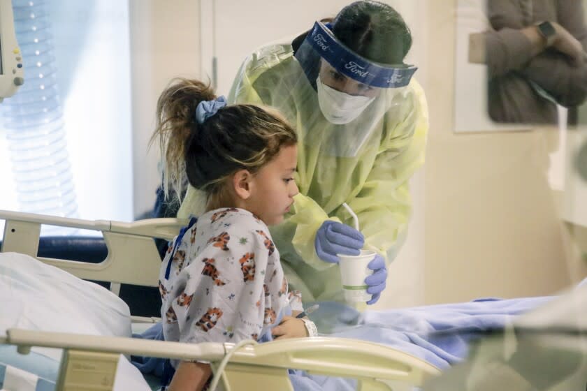 San Diego, CA - January 19: Nurse Jessica Serven attends to 6-year-old COVID19 patient Rachel Ward at Rady Children's Hospital on Wednesday, Jan. 19, 2022 in San Diego, CA. (Irfan Khan / Irfan Khan)