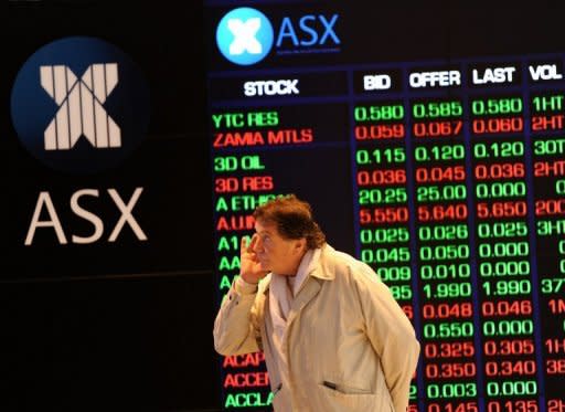 A new Australian stock exchange conducted its first trades Monday, ending a decades-long monopoly in the country, with the government hailing the market as a boon for "mum and dad" investors