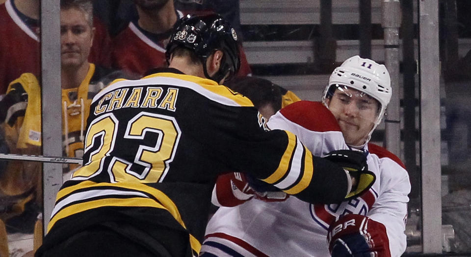 BOSTON, MA - MAY 10: Zdeno Chara #33 of the Boston Bruins checks Brendan Gallagher #11 of the Montreal Canadiens during the third period during Game Five of the Second Round of the 2014 NHL Stanley Cup Playoffs at the TD Garden on May 10, 2014 in Boston, Massachusetts. The Bruins defeated the Canadians 4-2. (Photo by Bruce Bennett/Getty Images) 