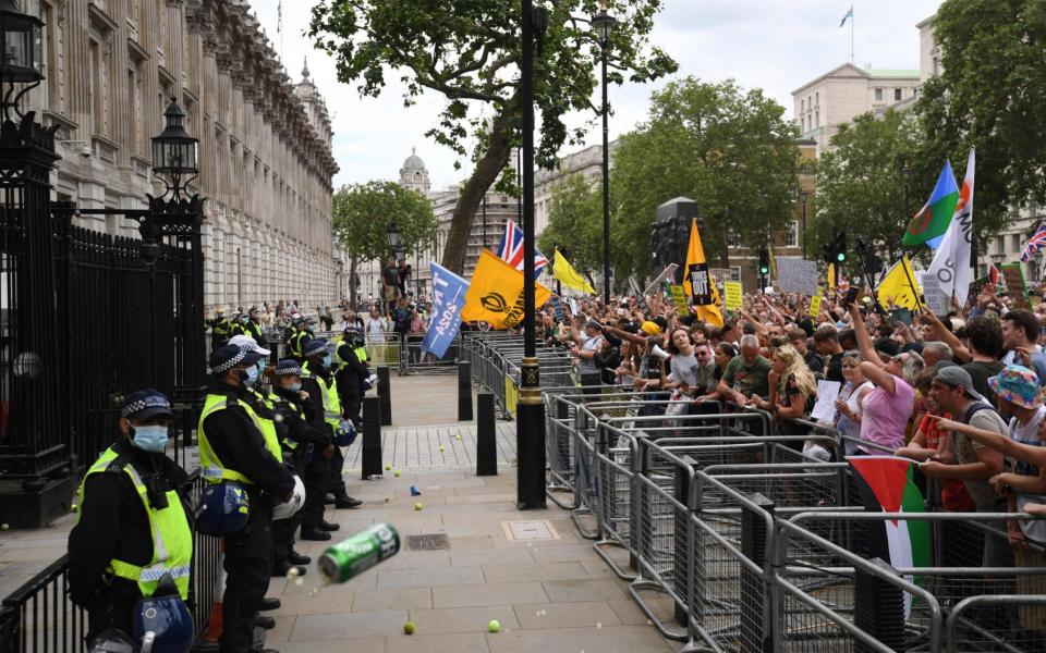 Anti-lockdown protesters booed and chanted 'shame on you' outside Downing Street this afternoon - DANIEL LEAL-OLIVAS/AFP