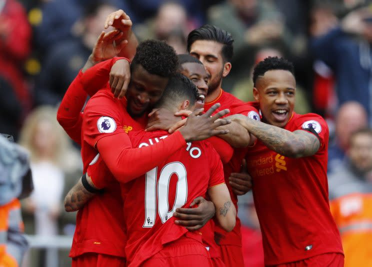 Liverpool’s Divock Origi celebrates scoring their third goal with team mates