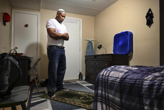 Lincoln, a convert to Islam, prays in his basement apartment. He says the religion taught him how to forgive – himself and others