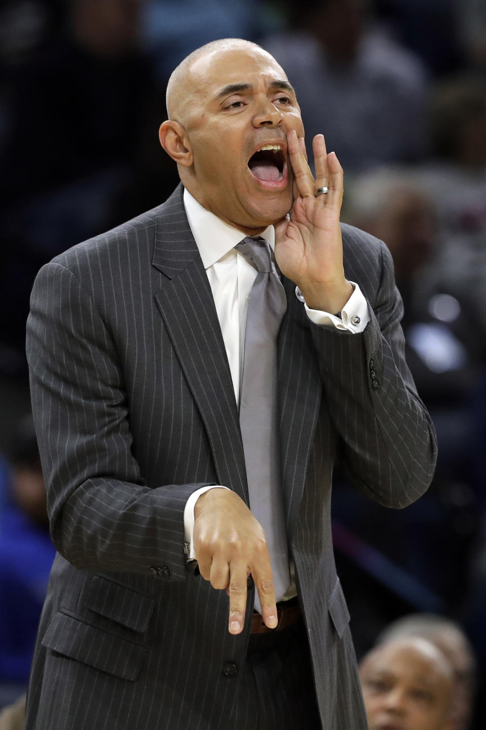 FILE - In this Nov. 15, 2018, file photo, DePaul coach Dave Leitao shouts to his team during the first half of an NCAA college basketball game against Penn State, in Chicago. The NCAA suspended men’s basketball coach Dave Leitao for the first three games of the regular season Tuesday, July 23, 2019, saying he should have done more to prevent recruiting violations by his staff. The NCAA also put the Big East program on three years of probation, issued a $5,000 fine and said an undetermined number of games will be vacated because DePaul put an ineligible player on the floor. An unidentified former associate head coach is also facing a three-year show cause order for his role in the violations. (AP Photo/Nam Y. Huh, FIle)