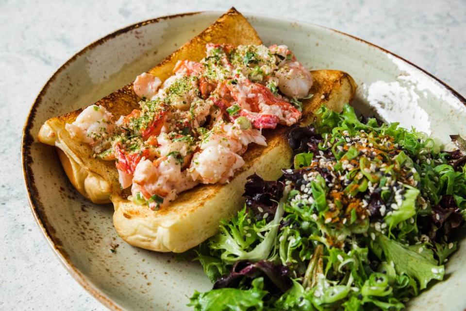 Fin & Fino’s lobster and shrimp roll, with mayo, lime, togarashi, sesame, chilled salad on a roll.