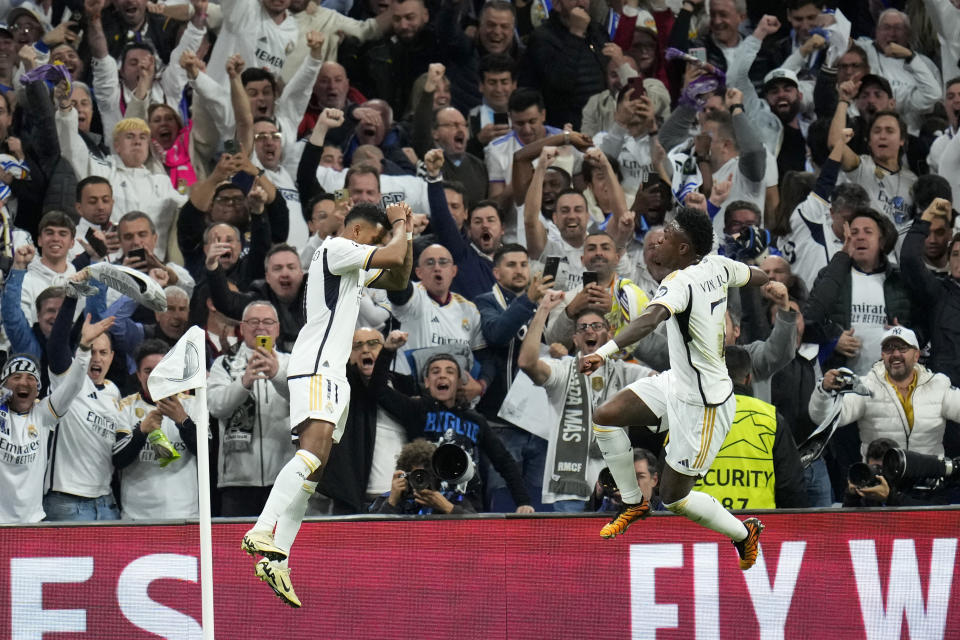 Real Madrid's Rodrygo celebrates scoring his side's second goal during the Champions League quarterfinal first leg soccer match between Real Madrid and Manchester City at the Santiago Bernabeu stadium in Madrid, Spain, Tuesday, April 9, 2024. (AP Photo/Manu Fernandez)