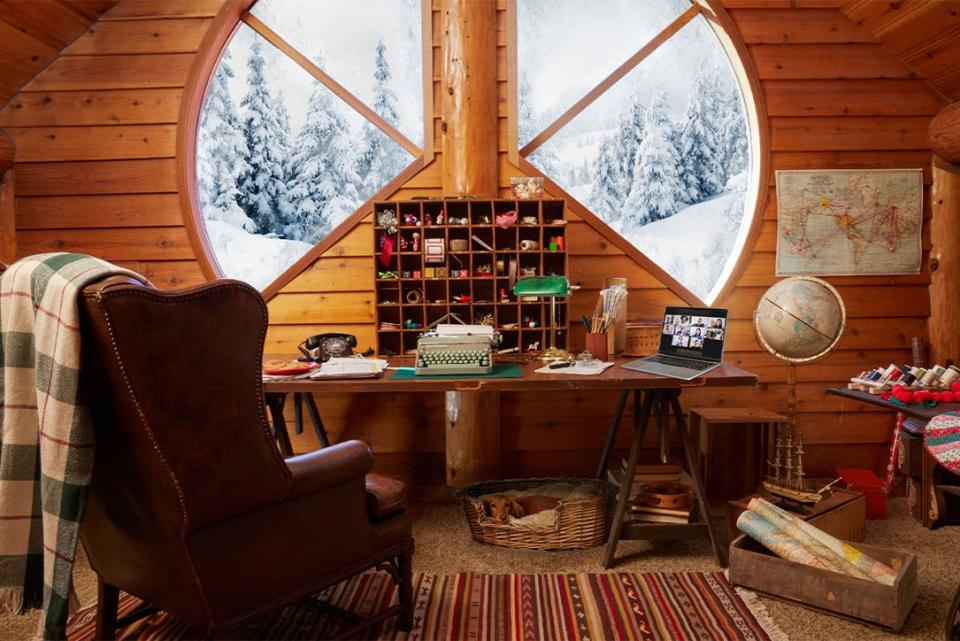 Photo of Santa's study with a window looking out onto snow covered trees