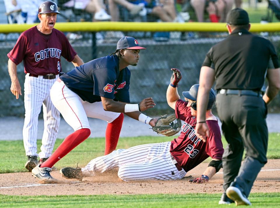 Cole Mathis of Cotuit arrives at third ahead of the throw to Bourne third baseman Cam Foster for a bases-loaded triple in the second inning in this Wednesday action.