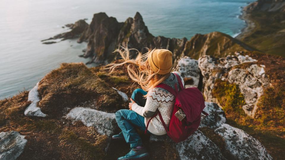 Woman relaxing alone travel in Norway adventure