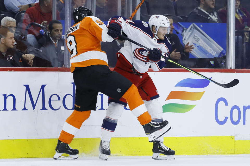 Columbus Blue Jackets' Gustav Nyquist, right, and Philadelphia Flyers' Ivan Provorov collide during the first period of an NHL hockey game, Tuesday, Feb. 18, 2020, in Philadelphia. (AP Photo/Matt Slocum)