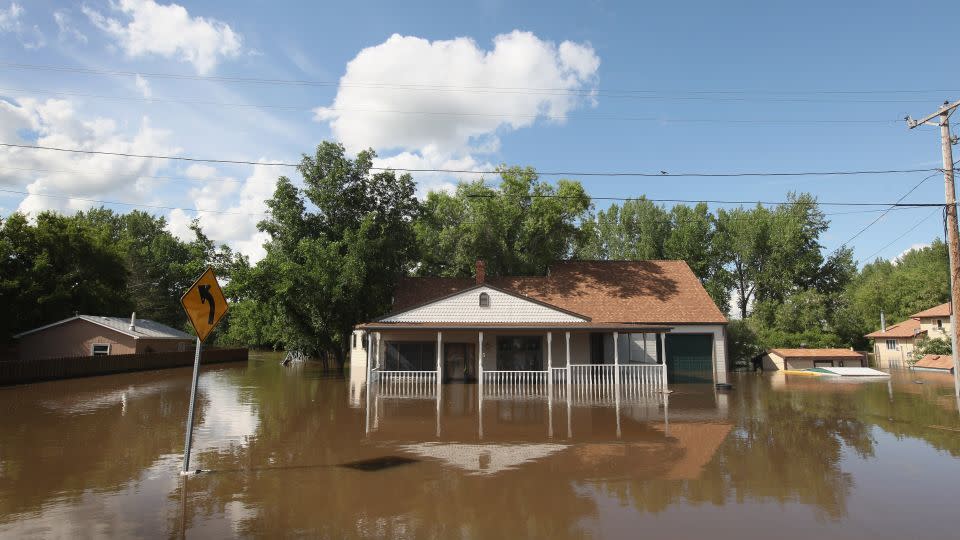 A home is surrounded by floodwater June 26, 2011, in Burlington, North Dakota. The Souris River, which runs through Burlington and nearby Minot, flooded thousands of homes in the two communities. - Scott Olson/Getty Images