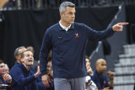 Virginia coach Tony Bennett gestures to the team during the second half of an NCAA college basketball game against Baylor on Friday, Nov. 18, 2022, in Las Vegas. (AP Photo/Chase Stevens)