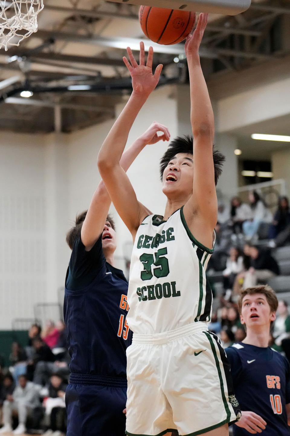 George School forward Ziyi Xiong goes up for a shot.