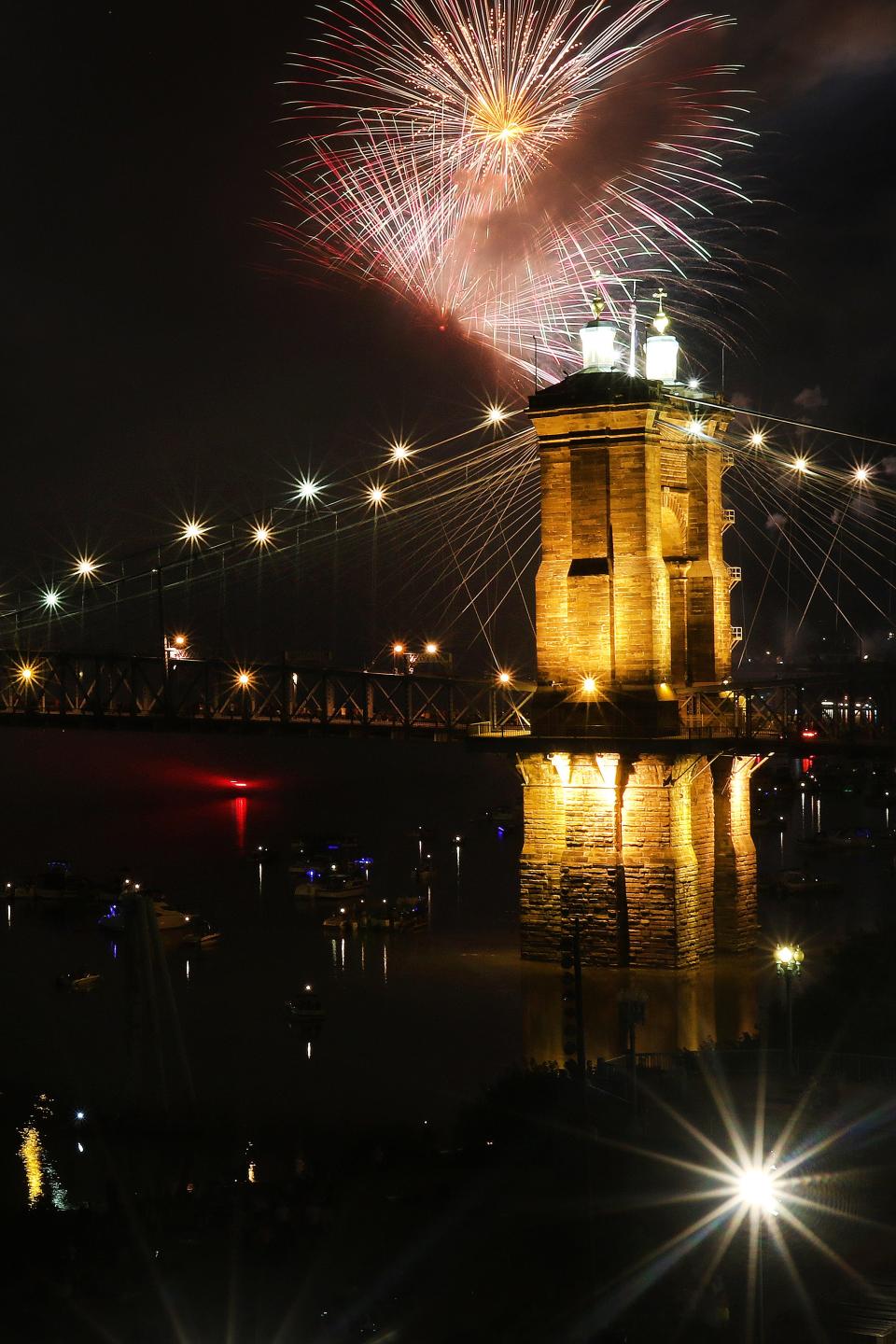 A view from the Covington Marriott at Rivercenter as the fireworks light up the Ohio River and the Roebling Bridge on Sunday, September 1. The Riverfest/Western and Southern WEBN Fireworks is a tradition that brings hundreds of thousands of people to the riverfront. 