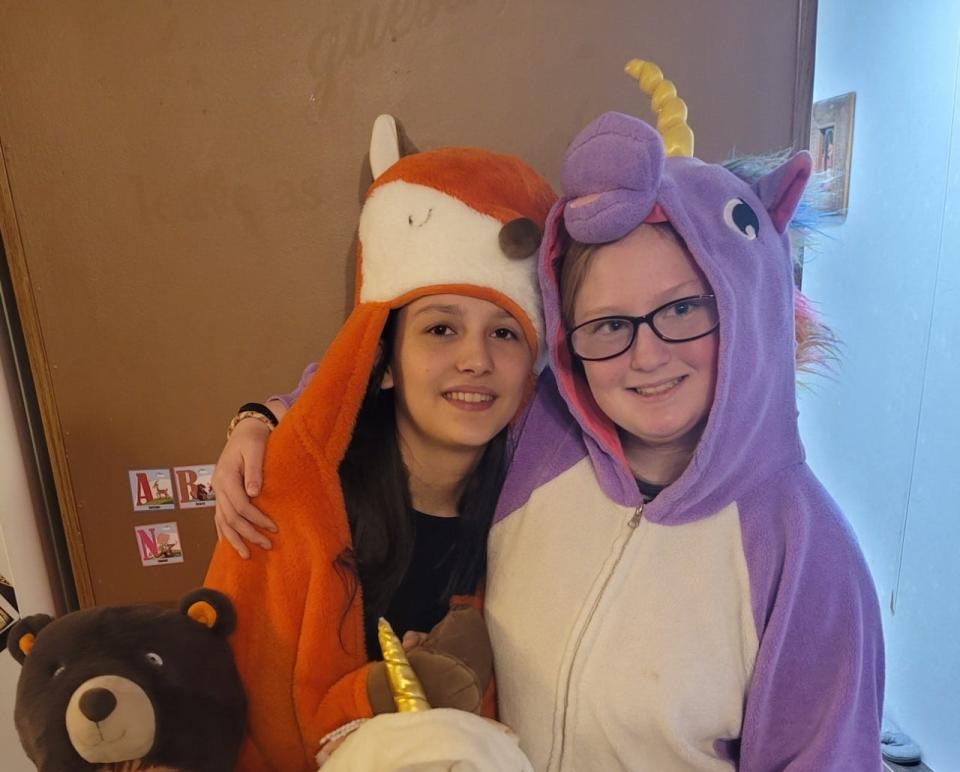 Isabel Cardenas (left) and Jersey Howe (right) pose in animal onesies. Cardenas was Howe's best friend.
