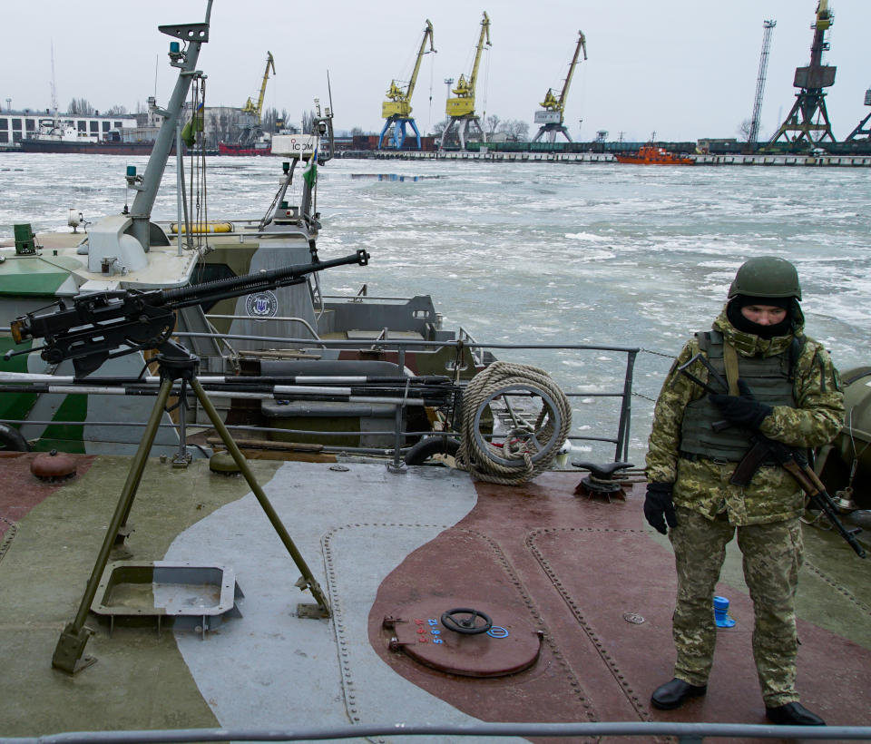 A Ukrainian serviceman stands on board a coast guard ship in the Sea of Azov port of Mariupol, eastern Ukraine, Monday, Dec. 3, 2018. The Ukrainian military has been on increased readiness as part of martial law introduced in the country in the wake of the Nov. 25, 2018 incident in the Sea of Azov, in which the Russian coast guard fired upon and seized three Ukrainian navy vessels along with their crews. (AP Photo/Mstyslav Chernov)