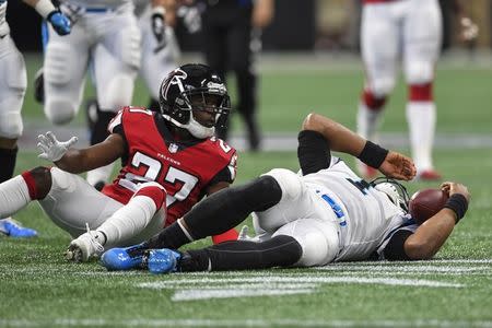 Sep 16, 2018; Atlanta, GA, USA; Carolina Panthers quarterback Cam Newton (1) lays on the field after being hit by Atlanta Falcons cornerback Damontae Kazee (27) during the first half at Mercedes-Benz Stadium. Mandatory Credit: Dale Zanine-USA TODAY Sports