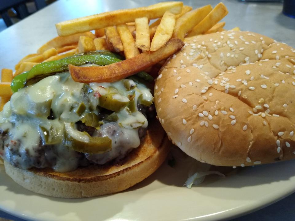 The Baja Burger at Akron Family Restaurant comes with chips, but diners can upgrade to fries and coleslaw.