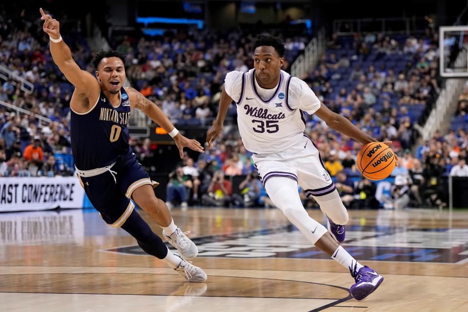 Kansas State's Nae'Qwan (35), at 6-foot-10, drives to the basket against Montana State guard Caleb Fuller (0) during their first-round NCAA Tournament game Thursday night at Greensboro Coliseum. The Wildcats are counting on Tomlin to come up big in Sunday's second-round matchup with Kentucky.
