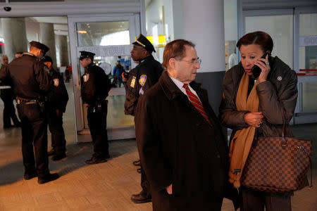 Congressman Jerrold Nadler (L) and Congresswoman Nydia Velazquez (R) stand in the entrance of Terminal 4 at John F. Kennedy International Airport in Queens, New York, U.S., January 28, 2017. REUTERS/Andrew Kelly