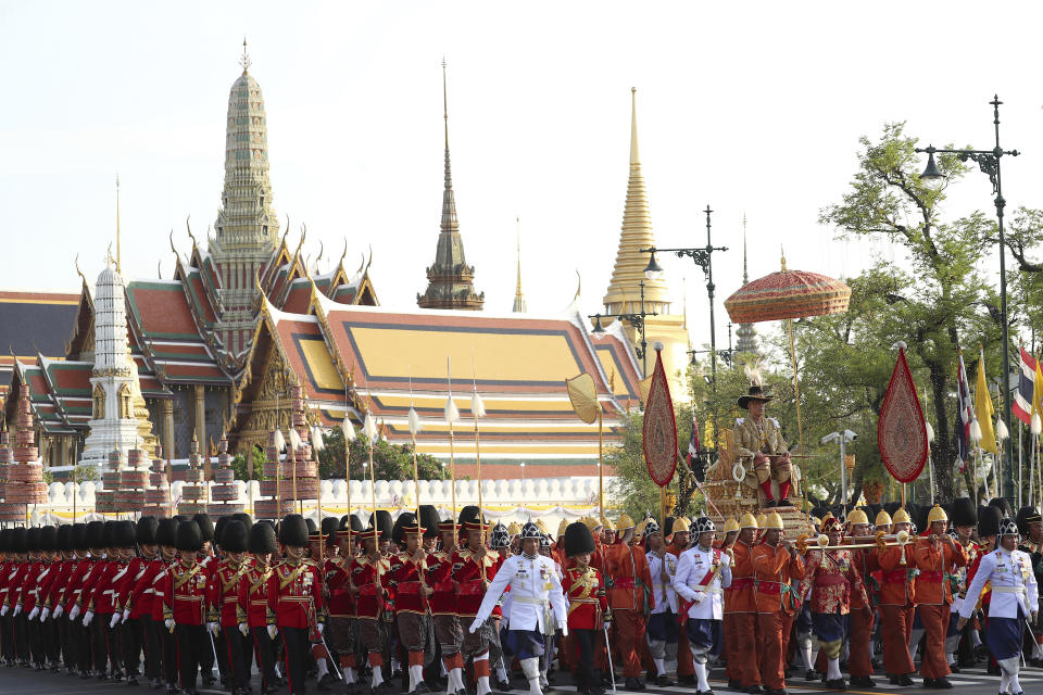 Thailand’s King Maha Vajiralongkorn is carried on a palanquin through the streets outside the Grand Palace for the public to pay homage during the second day of his coronation ceremony in Bangkok, Sunday, May 5, 2019. Vajiralongkorn was officially crowned Saturday amid the splendor of the country's Grand Palace, taking the central role in an elaborate centuries-old royal ceremony that was last held almost seven decades ago. (AP Photo/Rapeephat Sitichailapa)