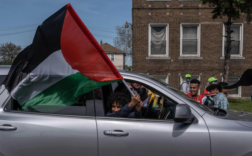 A protester waves a Palestinian flag during a march through neighborhoods near a Ford plant where U.S. President Joe Biden was touring in Dearborn, Mich., on May 18.<span class="copyright">Seth Herald—AFP/Getty Images</span>