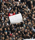 Protesters chant slogans against President Zine El Abidine Ben Ali in Tunis, Friday, Jan. 14, 2011. Some thousands of angry demonstrators marched through the Tunisian capital Friday, demanding the resignation of the country's autocratic leader a day after he appeared on TV to try to stop deadly riots that have swept the North African nation. On Thursday Jan. 14, 2021, Tunisia commemorates 10 years since the flight into exile of its iron-fisted leader, Zine El Abidine Ben Ali, pushed from power in a popular revolt that foreshadowed the so-called Arab Spring. (AP Photo/Christophe Ena)