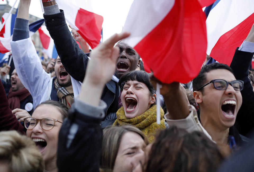 <p>Supporters of French independent centrist presidential candidate, Emmanuel Macron react outside the Louvre museum in Paris, France, Sunday, May 7, 2017. (Laurent Cipriani/AP) </p>