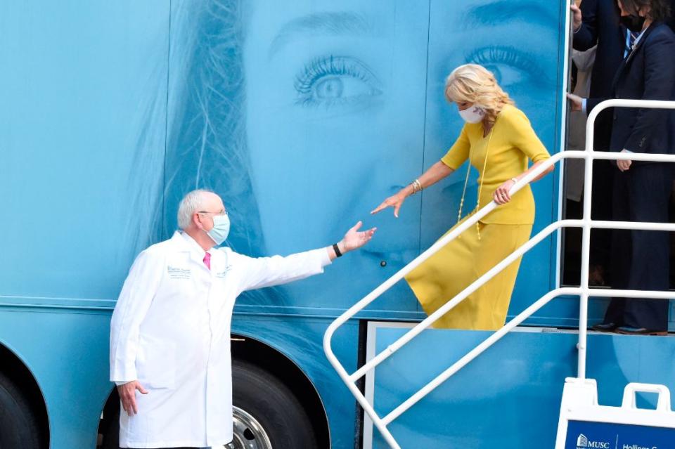 First lady Jill Biden is escorted by Dr. Raymond DuBois at the Medical University of South Carolina Hollings Cancer Center in Charleston, S.C., Oct. 25. - Credit: AP