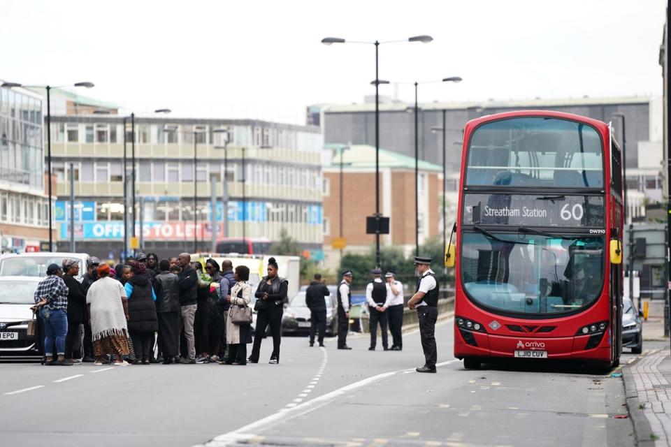 Family and friends of Elianne Andam at the scene in Croydon (PA Wire)