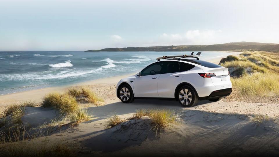 2024 tesla model y parked on a beach