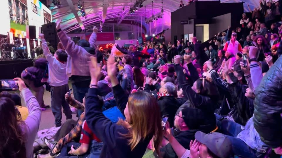 Philippines fans celebrate their team's goal against New Zealand at the 2023 Women's World Cup in a FIFA fan park in Auckland, New Zealand. - Tara Subramaniam/CNN
