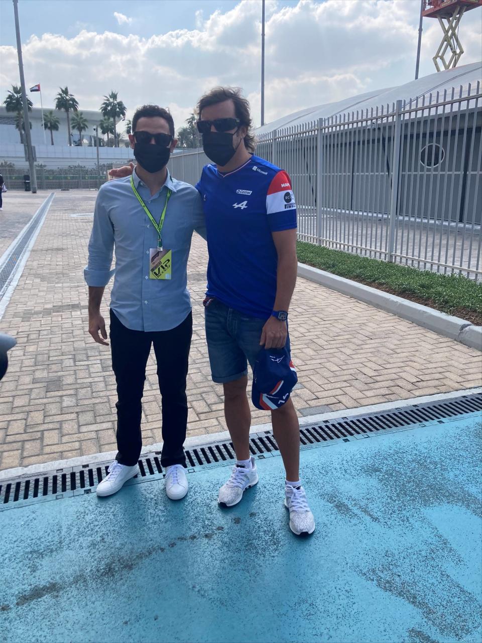 NASCAR champion Kyle Larson, left, talks to Formula One driver Fernando Alonso on Sunday, Dec. 12, 2021 at Yas Marina Circuit before the Formula One season-ending Abu Dhabi Grand Prix. Larson attended his first ever F1 race as part of his weeklong visit to Dubai and Abu Dhabi during a vacation following his Cup championship win. (AP Photo/Jenna Fryer)