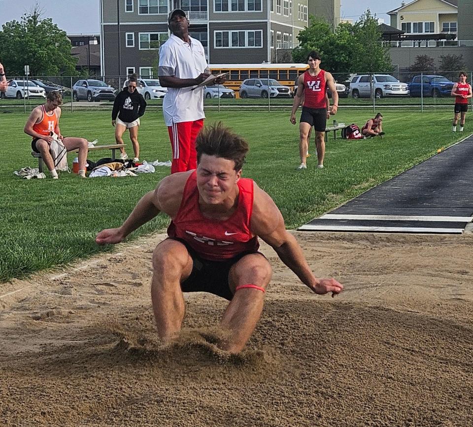 West Lafayette senior long jumper David Curl lands in the sand pit during the 75th Hoosier Conference Championship at Gordon Straley Field in West Lafayette, Ind. on Friday, May 3, 2024.