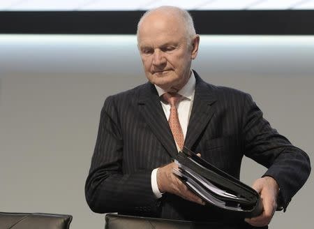 Ferdinand Piech, chairman of the board of German carmaker Volkswagen, carries his documents as he arrives at the 51th annual shareholders meeting in Hamburg on May 3, 2011. REUTERS/Fabian Bimmer