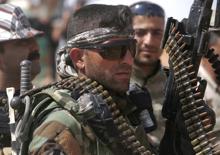 An Iraqi fighter from the Shiite Muslim Al-Abbas popular mobilisation unit, pictured near the village of Nukhayb in the embattled Anbar province, on May 19, 2015