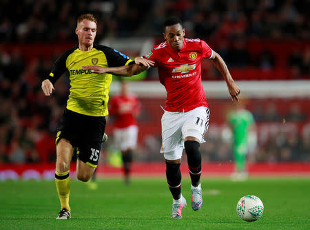 Soccer Football - Carabao Cup Third Round - Manchester United vs Burton Albion - Old Trafford, Manchester, Britain - September 20, 2017 Manchester United's Anthony Martial in action with Burton Albion's Tom Naylor Action Images via Reuters/Jason Cairnduff