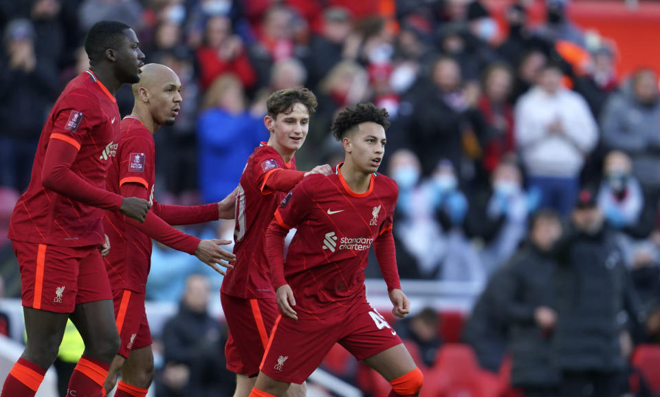 Liverpool's Kaide Gordon, right, celebrates with teammates after scoring his side's opening goal during the English FA Cup third round soccer match between Liverpool and Shrewsbury Town at Anfield stadium in Liverpool, Sunday, Jan. 9, 2022. (AP Photo/Jon Super)