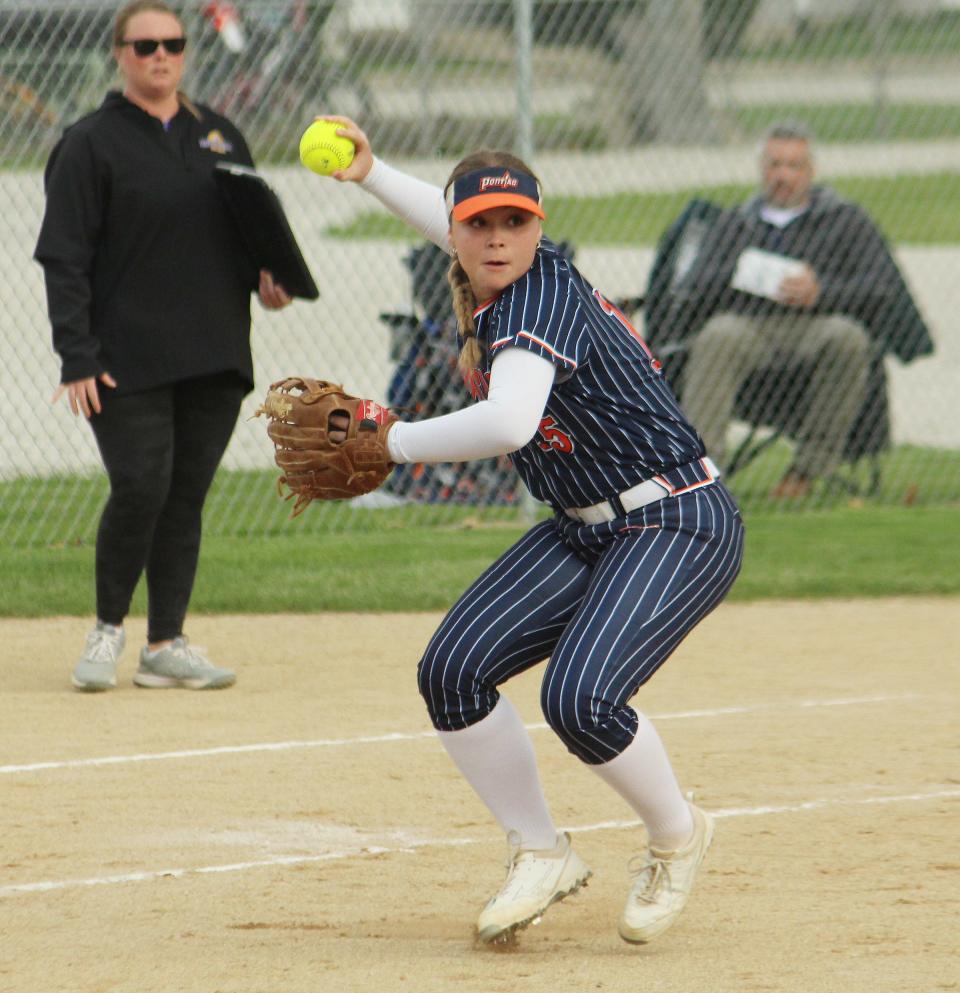 Pontiac third baseman Brooke Burger makes a throw to first for an out during the Indians' 12-2 IPC softball win over Monticello Monday.