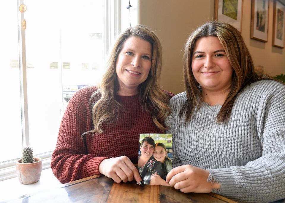 Jodi Kuipers and her daughter, Lauryn Kuipers, hold a photo of JodiÕs twin sister, Jennifer Torgerson, and niece, Kaylee Torgerson, on Friday, February 3, 2023, in Sioux Falls. Jennifer and Kaylee died after the pickup truck they were riding in collided with a train in December.