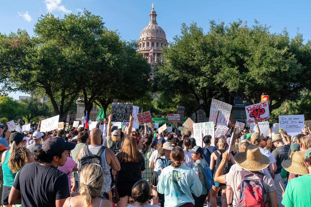 Abortion rights demonstrators gather near the State Capitol in Austin, Texas, June 25, 2022.