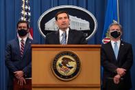 Assistant Attorney General John C. Demers of the National Security Division speaks during a press conference on a national security matter at the Department of Justice in Washington