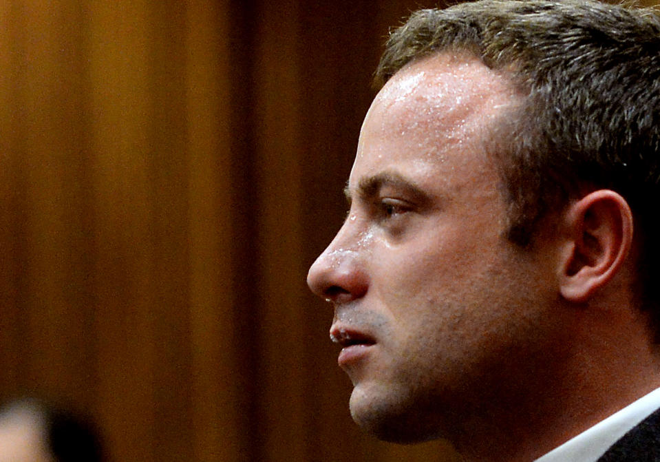 FILE: In this file photo taken Monday March 10, 2014, Oscar Pistorius cries as he listens to cross questioning about the events surrounding the shooting death of his girlfriend Reeva Steenkamp, in court during his trial in Pretoria, South Africa. Pistorius is expected to testify soon at his murder trial when the defense begins its case on Friday after four weeks of prosecution-led testimony. (AP Photo/Bongiwe Mchunu, Pool, File)