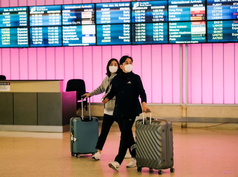 Passengers arrive at LAX from Shanghai, China